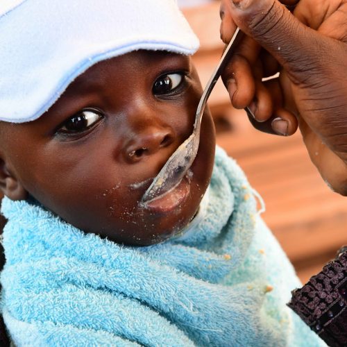 A mother feeding her baby at the Primature health center of San Pedro, in the South West of Côte d’Ivoire. 
Nurses demonstrate how to make bouille to mothers to feed their children suffering from malnutrition.

During the COVID-19 crise the UNICEF supported health center continues the work for the wellbeing of the children. 

In Côte d'Ivoire, the agriculture is rich and nutritious food available yet, 6% of children suffer from acute malnutrition requiring immediate medical intervention to survive and more than one in five children suffer from stunting. 

For every child, nutrition.